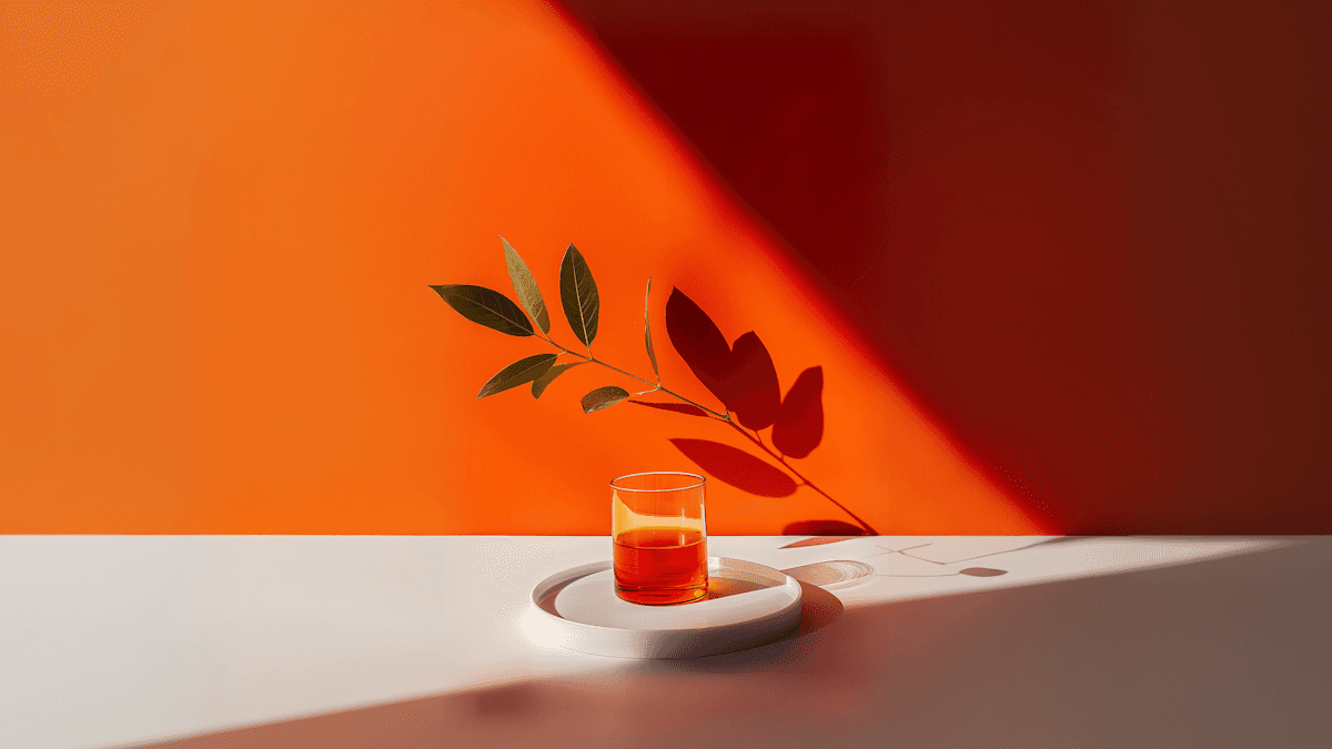 Amber Beverage and Plant Shadow Still Life